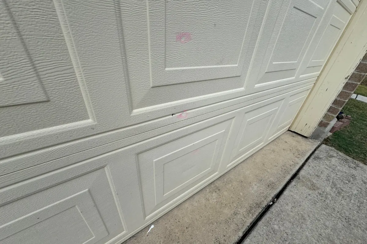 Hail strike mark on a garage door at a home on Staghorn Mill in Converse