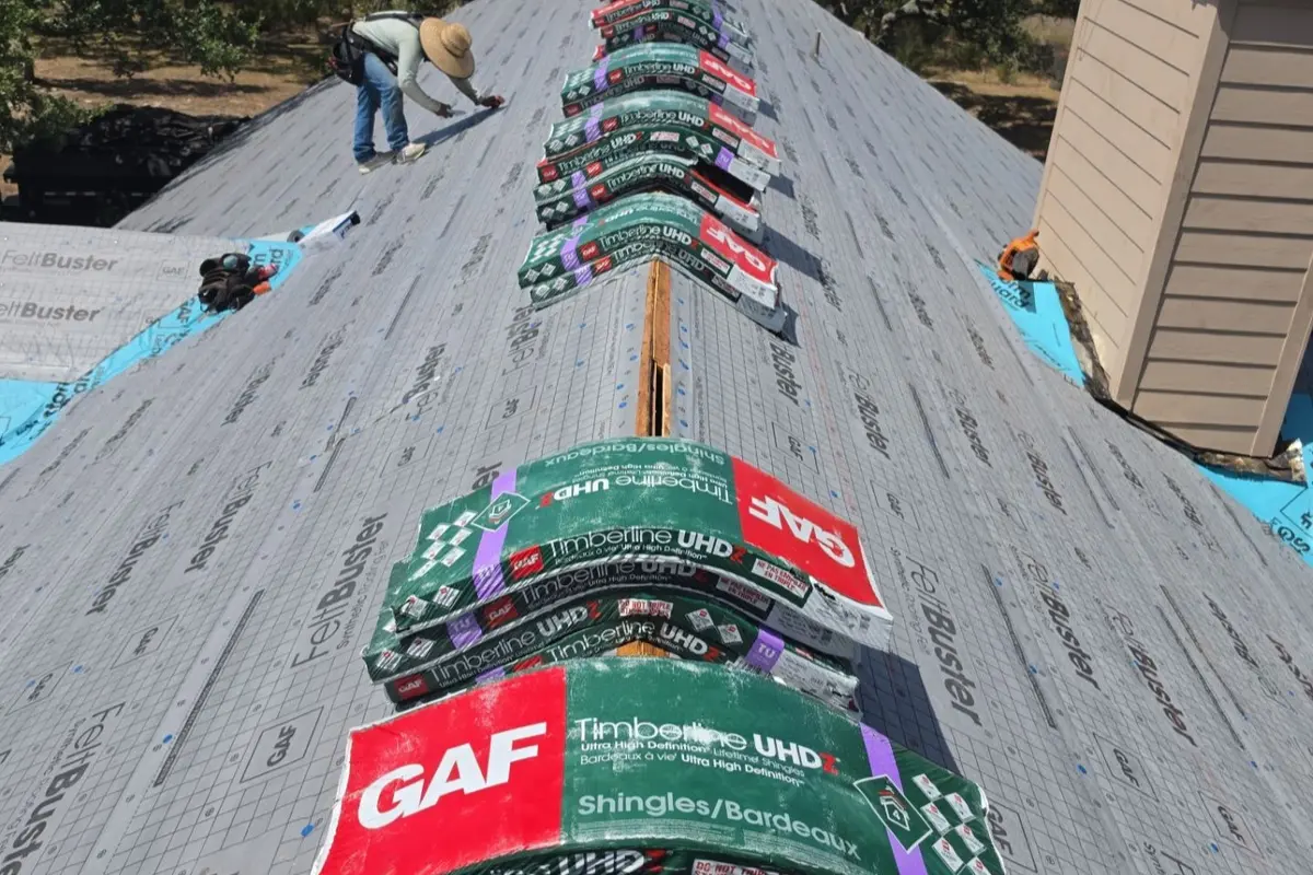 New underlayment installed on a Bergheim, TX roof with GAF roofing system materials loaded on the roof