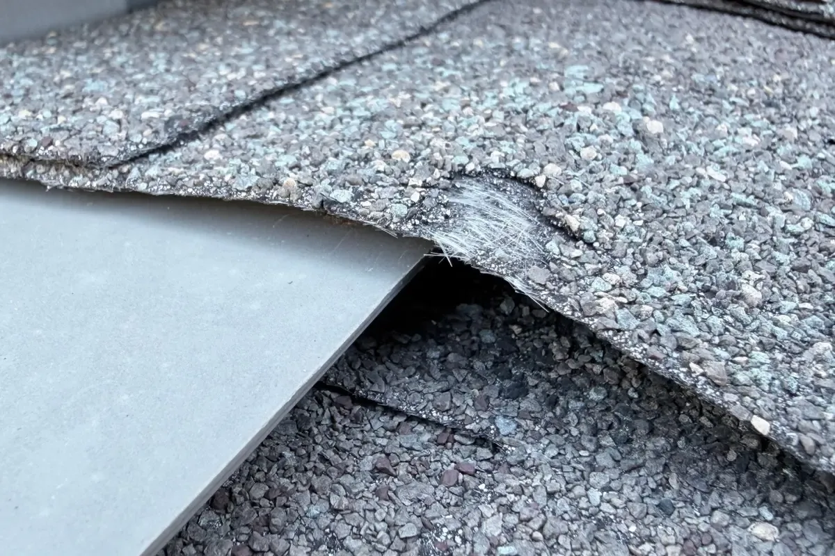 Inspection: granules worn away, fiberglass mat exposed in Indian Springs, San Antonio, TX