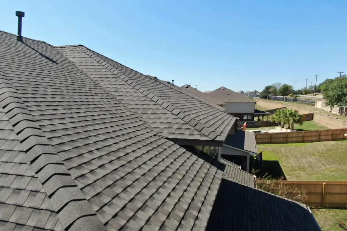 Completed: rear view with GAF TimberTex ridge caps in Indian Springs, San Antonio, TX