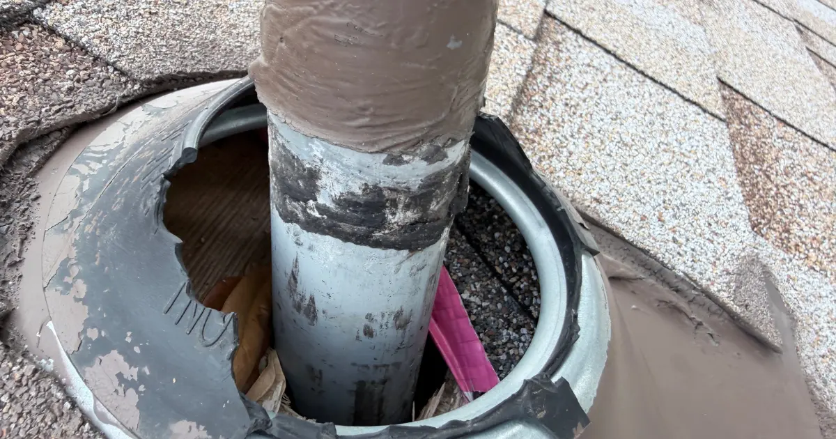 A rubber pipe boot with a hole gnawed through the side by an animal.