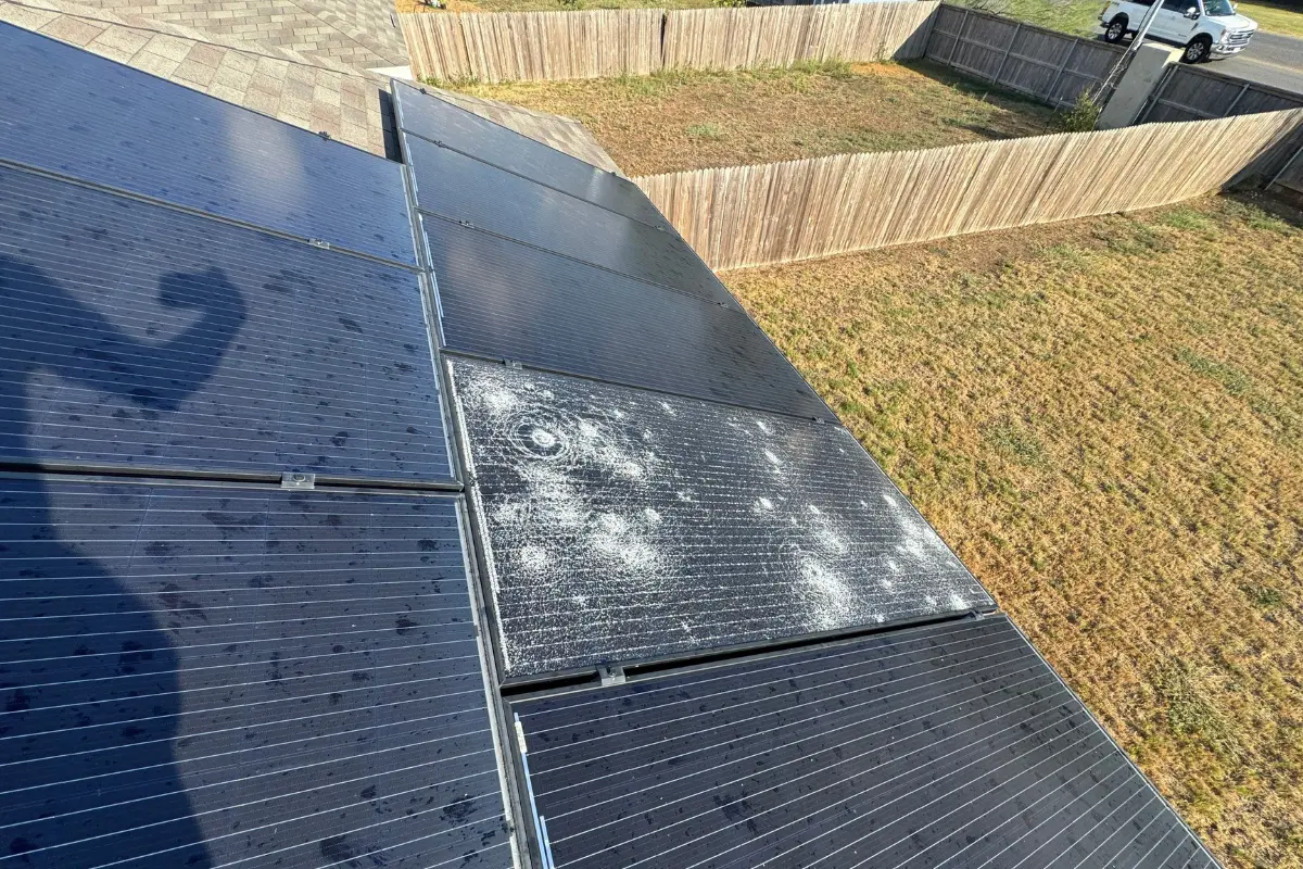 Second angle of hail impact and splatter marks on the same solar array on Gulf Meadow in Converse