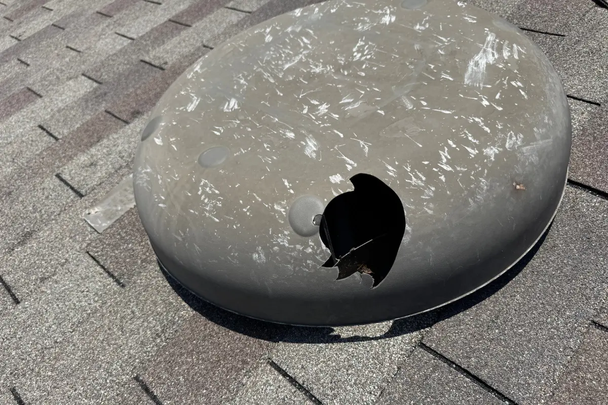 Plastic roof vent punctured through by hail at a home on Kellog Court in Converse after the September 11, 2026 hail storm