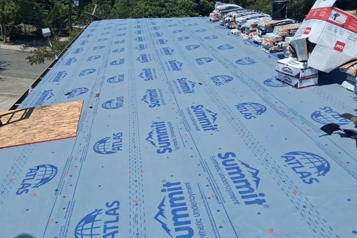 Synthetic underlayment installed over a clean roof deck